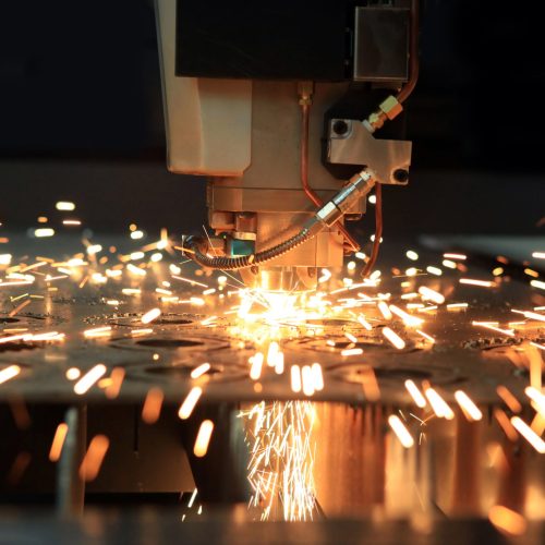 The industrial laser cutting torch cuts preparations from metal